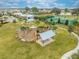 Aerial view of the community playground, tennis courts, and covered picnic area with beautiful landscaping at 1860 Tohoqua Blvd, Kissimmee, FL 34744
