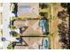 Aerial view of home highlighting screened-in pool at 240 Minniehaha Cir, Haines City, FL 33844