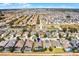 Expansive aerial view of neighborhood featuring tile roofs and screened-in pools under a clear sky at 240 Minniehaha Cir, Haines City, FL 33844