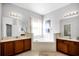 Bright and airy bathroom with a separate tub, double sinks, and vanities at 240 Minniehaha Cir, Haines City, FL 33844