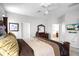 Spacious main bedroom with a king bed and en-suite bathroom at 240 Minniehaha Cir, Haines City, FL 33844