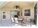 Covered outdoor dining patio with a view to the house at 240 Minniehaha Cir, Haines City, FL 33844