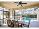 Screened patio featuring an outdoor dining area with a view of the pool at 240 Minniehaha Cir, Haines City, FL 33844