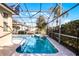 Screened in backyard pool and jacuzzi at 240 Minniehaha Cir, Haines City, FL 33844