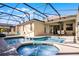 Backyard with screened-in pool and spa at 240 Minniehaha Cir, Haines City, FL 33844