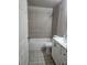 Bathroom featuring a tiled shower/tub combo, vanity, toilet, and tiled floor at 304 Lake Daisy Loop, Winter Haven, FL 33884