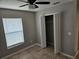 Bedroom featuring a ceiling fan, window, and closet at 304 Lake Daisy Loop, Winter Haven, FL 33884