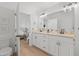 Bathroom featuring double vanity with white cabinets and modern fixtures at 3137 Sun Lake Ct # B, Kissimmee, FL 34747