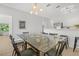 Dining room with contemporary table, chairs, and lighting located next to the kitchen area at 3137 Sun Lake Ct # B, Kissimmee, FL 34747