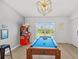 Game room featuring a pool table illuminated by a modern light, complete with view to the outside at 3137 Sun Lake Ct # B, Kissimmee, FL 34747