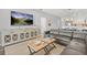 Open living room with a large gray sectional sofa, a decorative cabinet, and an open plan dining and kitchen area at 3137 Sun Lake Ct # B, Kissimmee, FL 34747