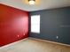 Spacious bedroom with colorful walls and neutral carpet, featuring a window with horizontal blinds at 3742 Maidencain St, Clermont, FL 34714