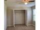 Bedroom with neutral carpet, bright natural light, an open closet and a ceiling fan at 3742 Maidencain St, Clermont, FL 34714
