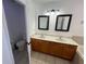 Bathroom featuring dual sinks and tile flooring at 375 Orange Cosmos Blvd, Davenport, FL 33837