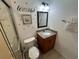 Bathroom featuring a shower, toilet, and vanity with 'beYOUtiful' wall decor at 375 Orange Cosmos Blvd, Davenport, FL 33837