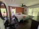 Inviting bedroom with a decorative accent wall, comfortable bed, and bright natural light at 375 Orange Cosmos Blvd, Davenport, FL 33837