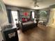 Themed bedroom with unique decor, dark wooden floors, and plenty of space for activities at 375 Orange Cosmos Blvd, Davenport, FL 33837