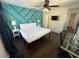 Well-lit bedroom with hardwood floors and an ensuite bathroom at 375 Orange Cosmos Blvd, Davenport, FL 33837