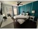 Comfortable bedroom with stylish decor, natural light, and a well-designed accent wall at 375 Orange Cosmos Blvd, Davenport, FL 33837