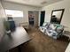 Bedroom space with an open doorway to another room featuring a desk and small loveseat at 375 Orange Cosmos Blvd, Davenport, FL 33837
