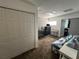 Bedroom featuring multiple closets, neutral paint and access to a nearby bedroom at 375 Orange Cosmos Blvd, Davenport, FL 33837