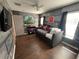The gray themed bedroom features beautiful hardwood floors and fun Harry Potter artwork on the walls at 375 Orange Cosmos Blvd, Davenport, FL 33837