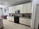 Bright kitchen features granite countertops, white cabinets, and stainless steel appliances at 375 Orange Cosmos Blvd, Davenport, FL 33837