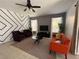 Inviting living room with modern decor, comfortable seating, and a contemporary aesthetic at 375 Orange Cosmos Blvd, Davenport, FL 33837
