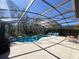 Enjoy a refreshing dip in this inviting, screened-in pool area offering both leisure and privacy at 375 Orange Cosmos Blvd, Davenport, FL 33837
