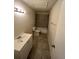 Bathroom featuring modern vanity and tiled shower-tub, perfect for relaxation and everyday routines at 4200 Thornbriar Ln # 208, Orlando, FL 32822