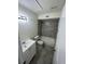 Bathroom featuring a modern vanity, tiled shower-tub, and sleek design at 4200 Thornbriar Ln # 208, Orlando, FL 32822