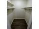 Walk in closet with shelves and rod for optimal storage at 4200 Thornbriar Ln # 208, Orlando, FL 32822