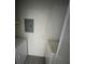 Efficient laundry room with washer, dryer, and storage shelving, perfect for convenient home management at 4200 Thornbriar Ln # 208, Orlando, FL 32822