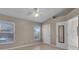 A bright bedroom featuring tile flooring and a large window with a view of the pool at 4815 Doc Dr, St Cloud, FL 34771