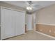 The bedroom has neutral paint, a ceiling fan, and a closet with folding doors at 4815 Doc Dr, St Cloud, FL 34771