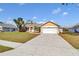 Charming single-story home featuring a well-manicured lawn, landscaping, and an attached two-car garage at 4815 Doc Dr, St Cloud, FL 34771