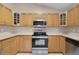 A well-equipped kitchen featuring stainless steel appliances and wood cabinetry at 4815 Doc Dr, St Cloud, FL 34771
