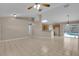 Expansive living area with views of the kitchen and pool, offering a seamless flow for entertaining at 4815 Doc Dr, St Cloud, FL 34771