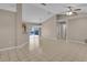 A spacious living area with tiled floors that flow seamlessly into the kitchen and pool area at 4815 Doc Dr, St Cloud, FL 34771