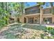 Lush backyard with mature trees and greenery offering privacy and natural beauty at 5311 Burning Tree Dr # D, Orlando, FL 32811