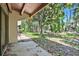 A serene backyard with a patio area that is nestled among trees at 5311 Burning Tree Dr # D, Orlando, FL 32811