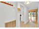 Home entryway boasts coat hooks and storage with a view of the living area at 5311 Burning Tree Dr # D, Orlando, FL 32811