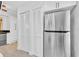 Bright kitchen with stainless refrigerator and plenty of storage space at 5311 Burning Tree Dr # D, Orlando, FL 32811