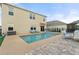 The backyard features a pool with patio seating and brick pavers, perfect for outdoor entertaining at 6808 Cranes Roost Rd, Harmony, FL 34773