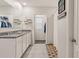 Bathroom featuring granite countertop, double sinks, and walk-in closet at 6808 Cranes Roost Rd, Harmony, FL 34773