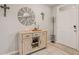 Entryway featuring stylish decor, including a decorative mirror and a modern storage cabinet at 6808 Cranes Roost Rd, Harmony, FL 34773