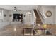 Open concept kitchen featuring stainless steel sink, granite countertops, and a view of the living area at 6808 Cranes Roost Rd, Harmony, FL 34773