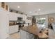 Open kitchen featuring a large center island, granite countertops, and stainless steel appliances at 6808 Cranes Roost Rd, Harmony, FL 34773