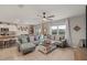 Spacious living room with tile floors, neutral colors, and ample natural light from a large window at 6808 Cranes Roost Rd, Harmony, FL 34773