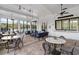 Resident lounge with a variety of seating and views of the pool and grounds at 6808 Cranes Roost Rd, Harmony, FL 34773